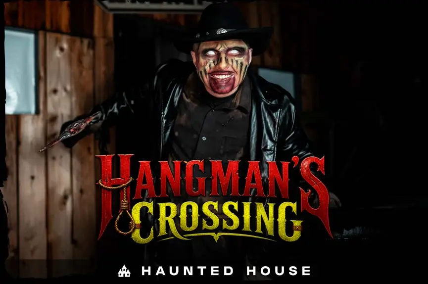 Undead cowboy with pure white eyes, a black hat, and a blood-stained mouth holding an axe for the Hangman's Crossing Haunted House.
