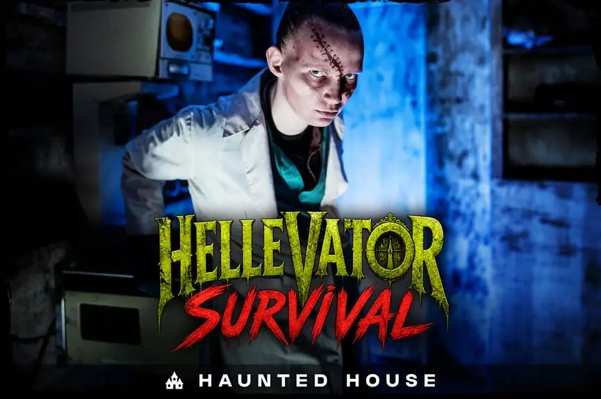 Pale, stitched-up mad scientist in a white coat staring intensely inside a blue-lit industrial elevator shaft for the Hellevator Survival Haunted House.